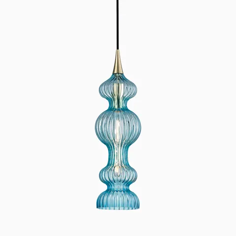 Elongated pendant with rippled blue glass and aged brass accents, casting fluid reflections and vibrant, artistic illumination.