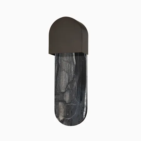Modern wall sconce with a domed bronze top and a striking black brass backplate.