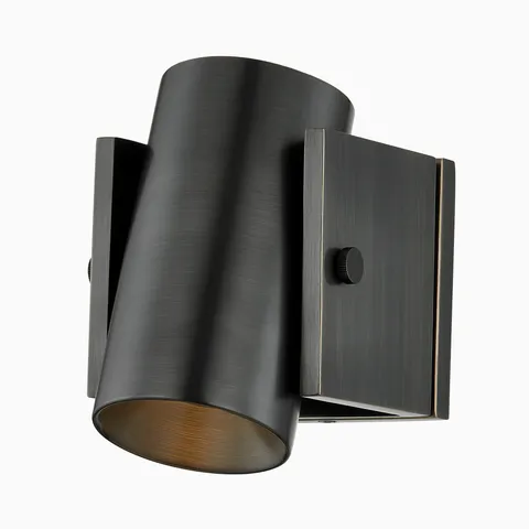 Adjustable spotlight sconce in oil-rubbed, distressedbronze with a sleek cylindrical design for directional lighting.