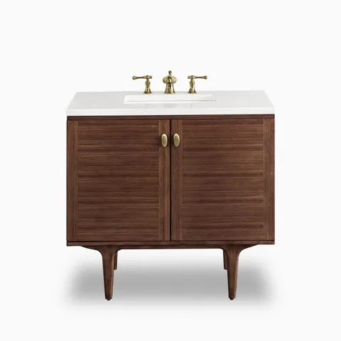 At 36 inches wide, the Demi single vanity pairs mid-century walnut cabinetry with rich horizontal wood grain doors and brass hardware, topped with a 3 cm White Zeus quartz surface.