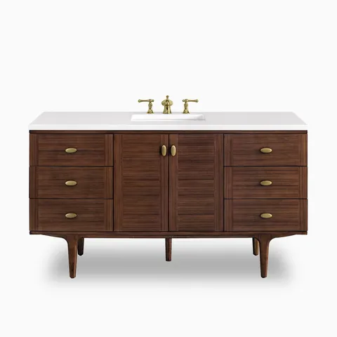 A 60 inch single vanity in mid-century walnut with warm horizontal wood grain, six drawers and a center cabinet, finished with a 3 cm White Zeus quartz countertop and brass faucet.