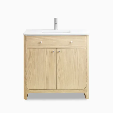 Coastal driftwood single vanity with white zeus quartz top, satin nickel knobs, and wide top drawer in a clean-lined, soft-edge design.