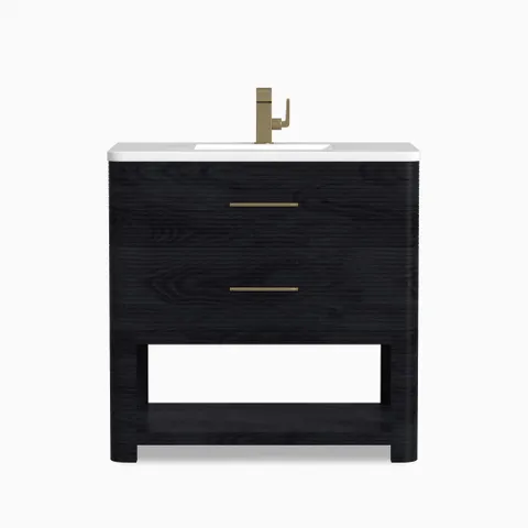 Paxton 36-inch single vanity in carbon oak with white countertop, integrated sink, brass faucet, two drawers, and open shelf.
