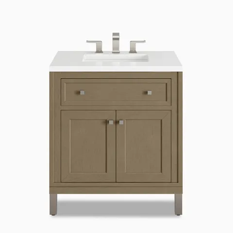 Natural brown cabinetry in Walnut Whisper highlights the Janelle 30 inch single vanity with framed cabinet panels, a spacious top drawer, and a White Zeus Silestone top.