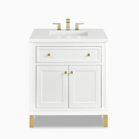 A smooth Glossy White finish highlights the Janelle 30 inch single vanity with framed cabinet panels, a spacious top drawer, brass hardware, and a White Zeus Silestone top.