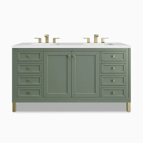 Double bathroom vanity with Smokey Celadon green wood cabinetry, framed cabinet doors, multiple storage drawers, and a bright White Zeus Silestone countertop with two sinks.