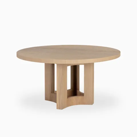 Round 60-inch dining table in natural wood with a smooth top and open geometric base, combining organic warmth with modern structure.