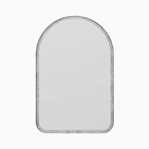 Arched mirror with a classic silhouette, framed by a narrow border finished in a rustic, light metallic sheen.