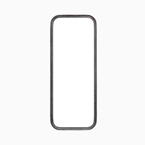 Elongated rounded rectangular mirror with a classic silhouette, framed by a narrow border in a rustic, dark metallic sheen.