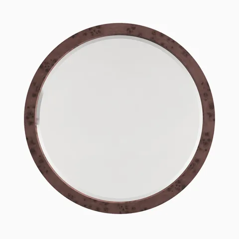 Round mirror framed in dark burl wood veneer, showcasing swirling grain patterns and rich tonal variation.