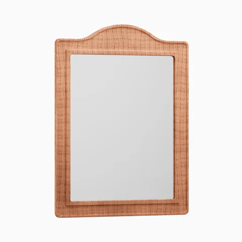 Rectangular mirror with an arched top, framed in handwoven brown raffia that adds warm texture and natural character.