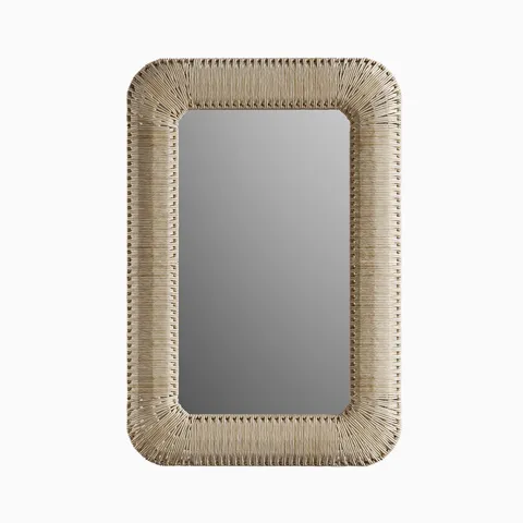 Rectangular mirror with rounded corners, wrapped in handwoven corn straw rope that adds natural texture and a refined tropical feel.