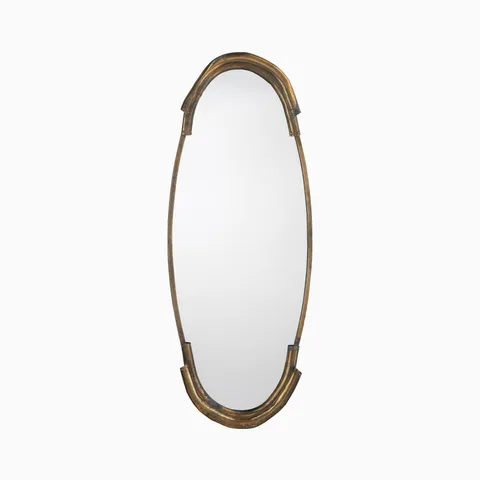 A slender oval mirror with chic arched detailing and an antique brass finish, featuring a warm, timeworn aluminum sheen that feels effortlessly romantic and Parisian.