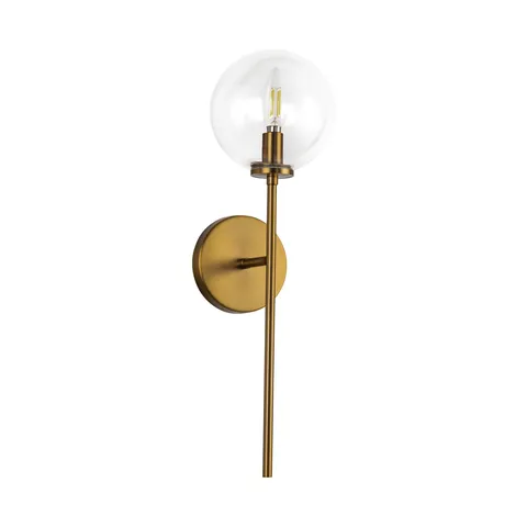 Modern wall sconce with clear glass globe shade and brushed brass vertical metal arm.