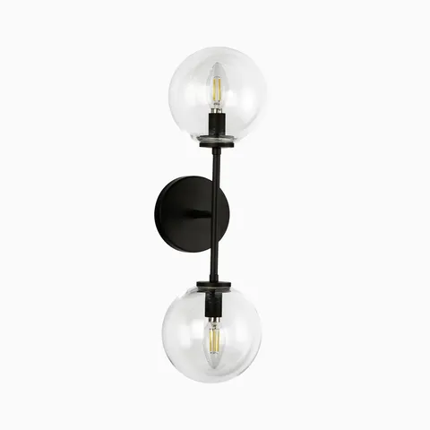 Modern wall sconce with dual clear glass globe shades and matte black vertical metal arm.
