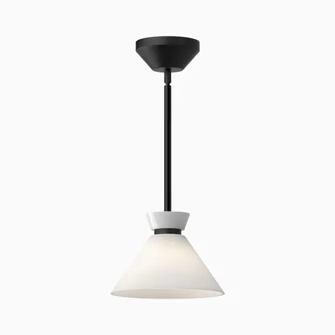 Matte black pendant light with glossy opal glass white conical shade suspended from a slim ceiling rod.