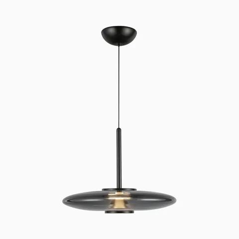 Matte black LED pendant light with a slim vertical rod and smoked glass disc shade, offering a floating modern design that softly spreads light above dining tables or seating areas.