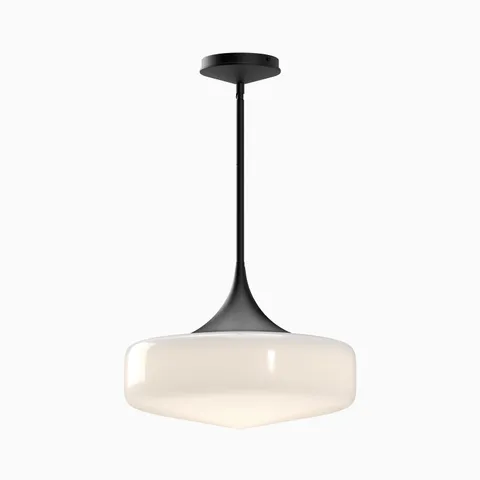 Matte black pendant light with a tapered stem and soft white glass shade, forming a smooth sculptural profile that diffuses warm ambient light in modern interiors.