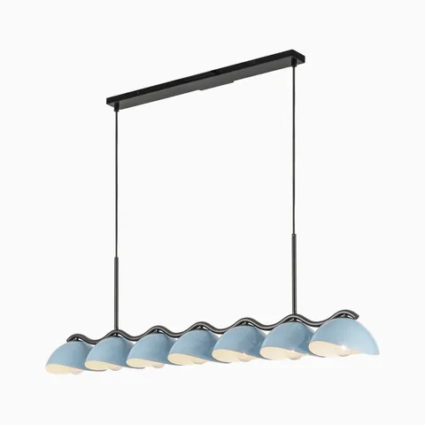 Linear pendant light with seven pastel blue dome shades and sculptural black wave frame in a modern design.