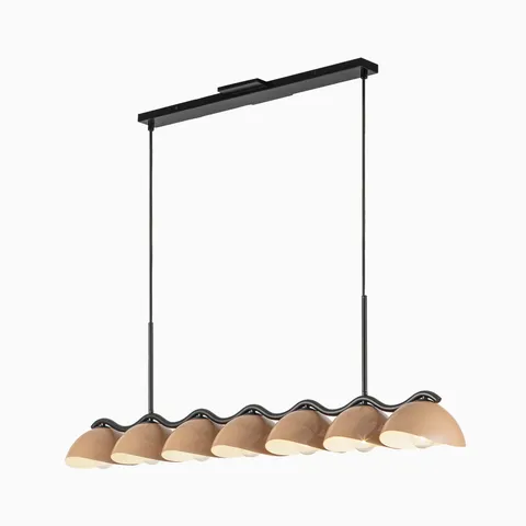 Linear pendant light with black frame and seven warm beige dome shades arranged in a sculptural wave design.