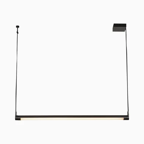 Matte black linear pendant light with a slim cylindrical bar and integrated LED strip, suspended by dark cords to provide focused task lighting above kitchen islands.