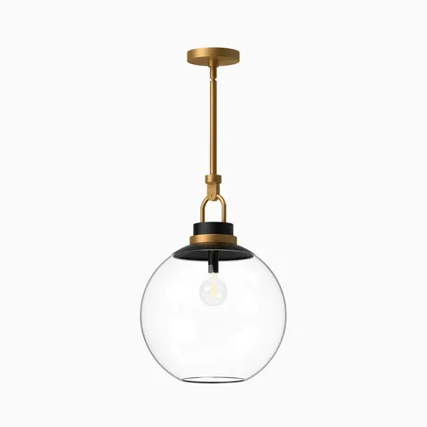 Aged gold pendant light with a clear glass globe shade, black accents, and a matching aged gold canopy.