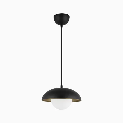Matte black pendant light with a dome metal shade and frosted globe diffuser, creating soft ambient lighting with a warm metallic interior accent.