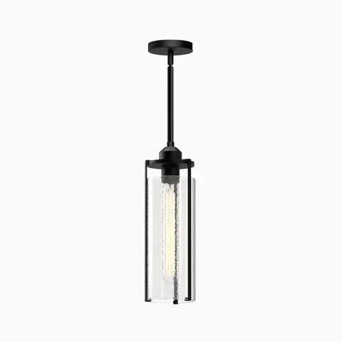 Slim black metal pendant light with cylindrical textured glass shade and vertical filament in a modern industrial design.