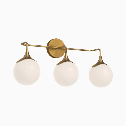 Brushed gold three light vanity wall fixture with curved arms and frosted glass globe shades aligned on a horizontal bar, providing balanced lighting for modern bathrooms.