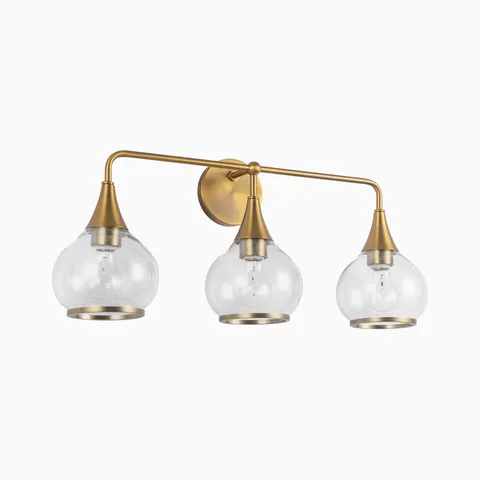 Aged gold three-light wall sconce with clear glass globe shades.