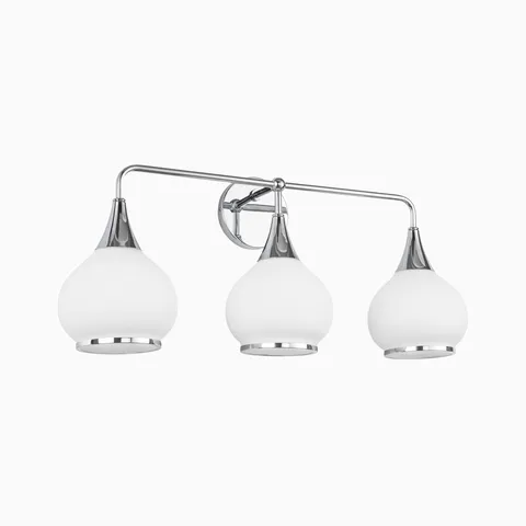Chrome three-light wall sconce with matte opal glass globe shades.