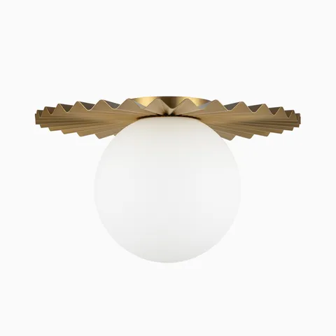Modern flush mount light with a folded brushed gold metal shade and white globe diffuser, offering soft diffused lighting with a bold geometric form.