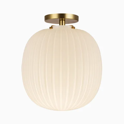 Flush mount ceiling light with a brushed gold canopy and glossy ribbed opal glass globe shade.