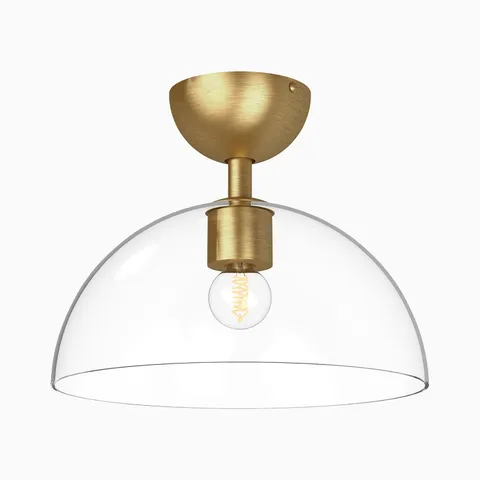 Brushed gold semi flush mount ceiling light with a clear glass dome shade and exposed filament bulb, pairing warm metallic tones with airy transparency for modern kitchens or entryways.