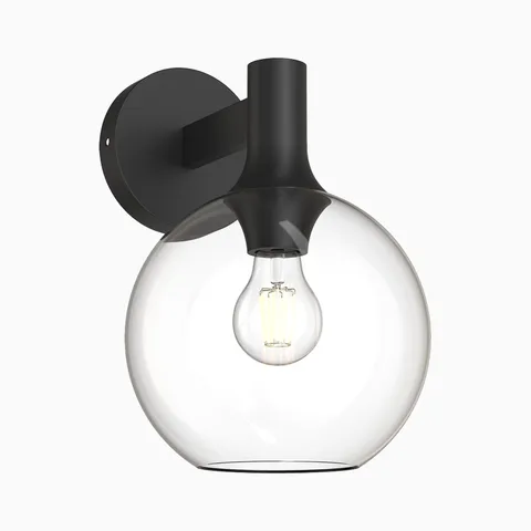 Wall sconce with clear glass globe shade and matte black backplate and arm.