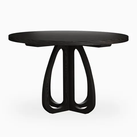Round black wood dining table with a slim tabletop and sculptural curved pedestal base, featuring open detailing for a refined modern look.