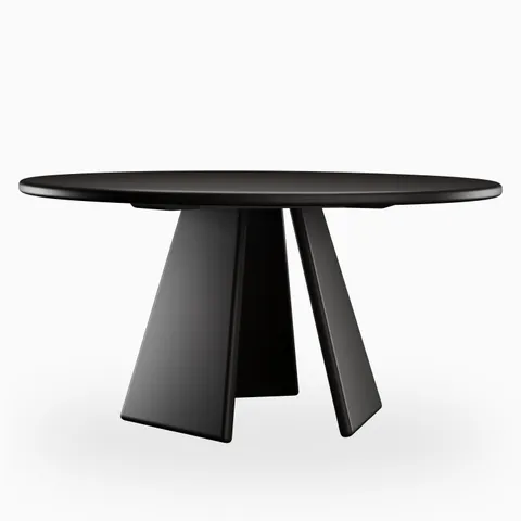 Round black dining table with a smooth rounded tabletop and three angled pedestal legs, presenting a bold sculptural form with a sleek modern finish.